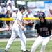 Milan center fielder Jacob Maas celebrates after scoring a run during the game against Richmond on Friday, June 14. Daniel Brenner I AnnArbor.com